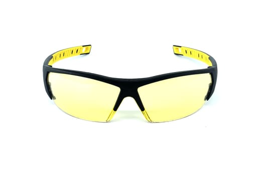 Protective safety glasses yellow lens isolated on a white background