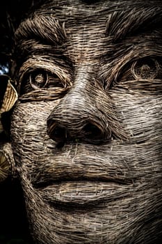Wicker balinese face at a resort shot close up
