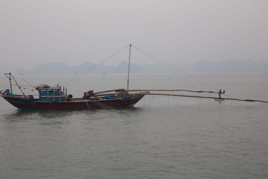 A traditional vietnamese fishing boat in Halong Bay