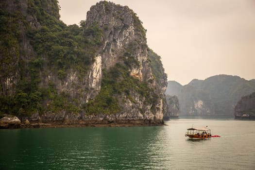A ferry in Halong bay in Vietnam doing a tour