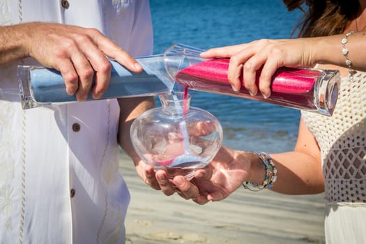 Bride and groom doing sand ceremony
