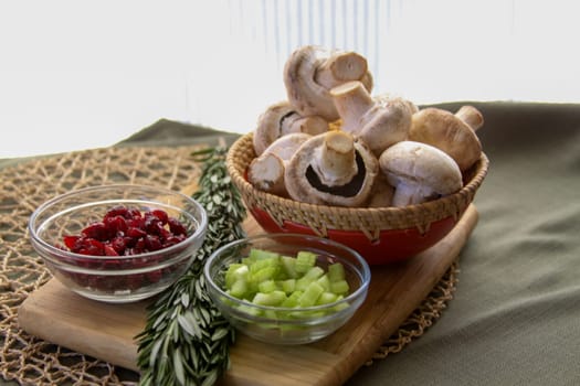 Vegan Thanksgiving Ingredients with rosemary on a chopping board