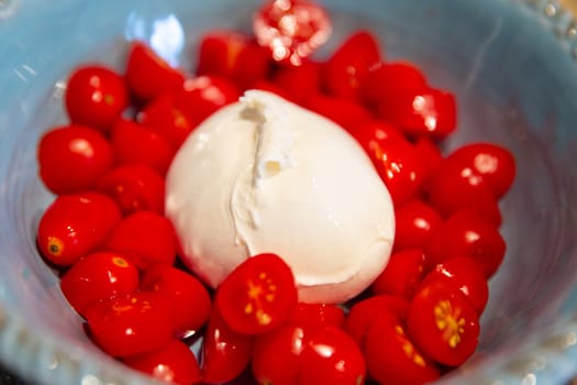Fresh burrata with sliced cherry tomatoes