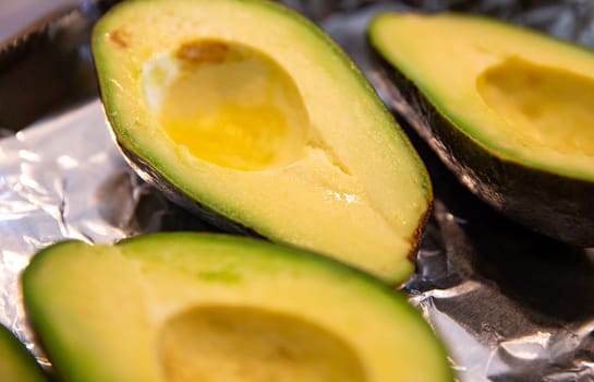 Sliced rip halves of ripe Avocados