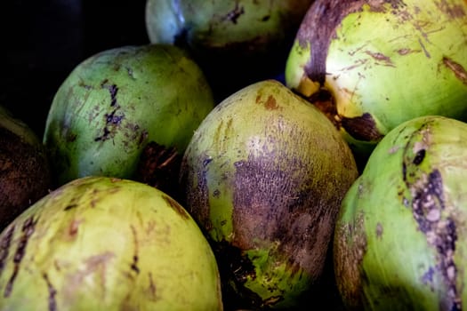 Fresh Green Uncut Coconuts at a market