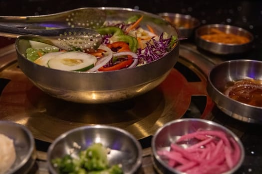 Salad and condiments at a Korean BBQ