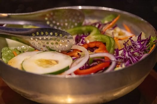 Shareable Salad with Tongs as a starter