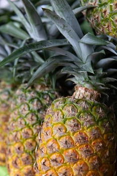 Ripe Pineapples st a farmers market for sale