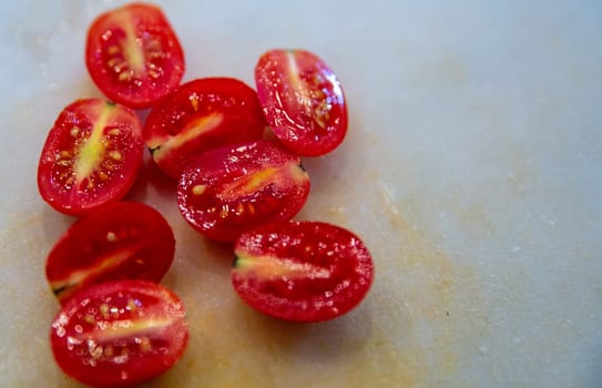 Half sliced Tomatoes top off a salad with room for text