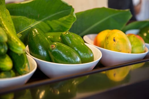 Fresh Mangos, avocados and cucumbers on display