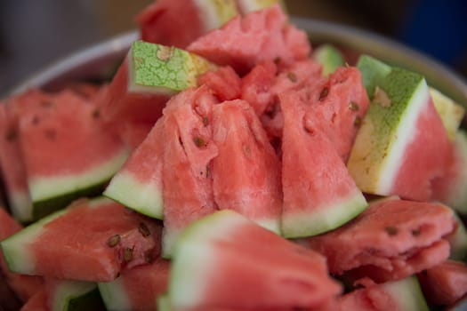 Bowl of sliced up watermelon to add