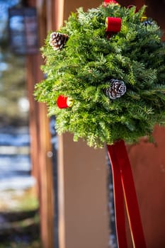 Outdoor Christmas Kissing Ball with barely any snow on it