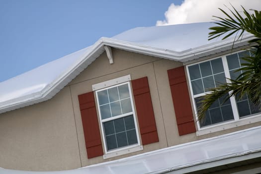 White tarped roof waiting to be fixed