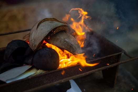 Prepping the grill for making satay in a cooking class