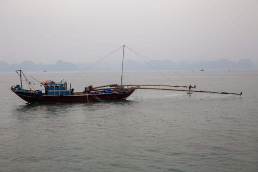 Traditional Vietnamese fishing boat on the bay