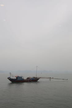 Traditional Vietnamese fishing boat on the bay