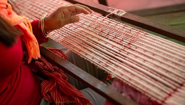 Cambodian Local Woman Weaving on a loom