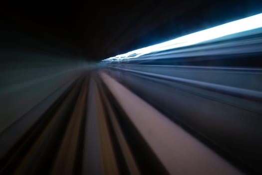 Front view of train Speeding through a Tunnel