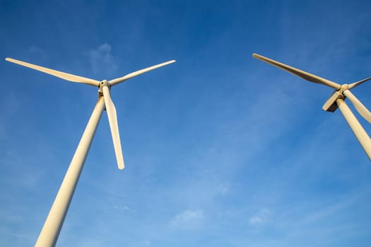 Duo of Wind Turbines shot from below