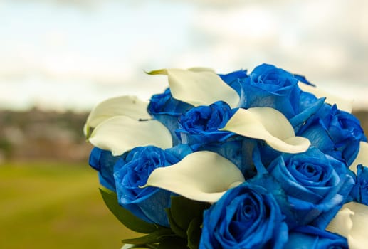 Blue and White Roses Wedding Bouquet shot outdoors