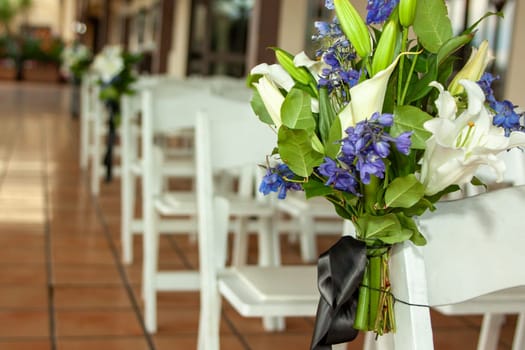 Floral designs of wedding aisle to show the area is ready