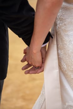 Bride and groom holding hands after the ceremony