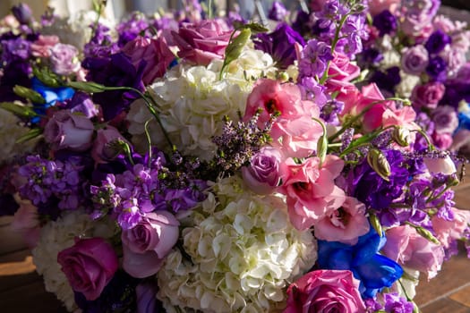 Close up of a centerpiece loaded with flowers