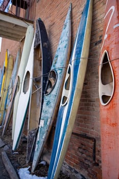 Canoes tied up in a row shot vertical