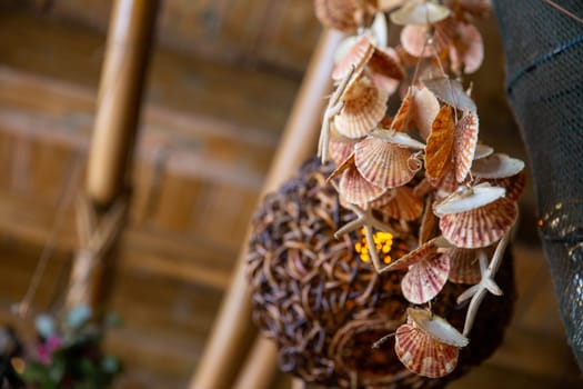 Dangling display with sea shells and starfish in a tiki bar
