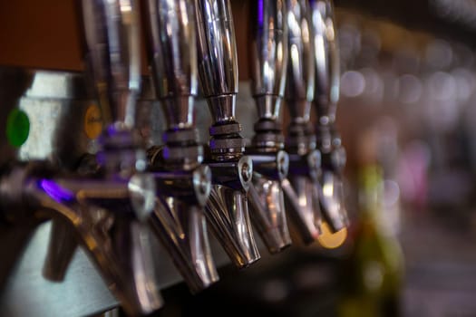 Row of Wine or Beer Taps on the bar