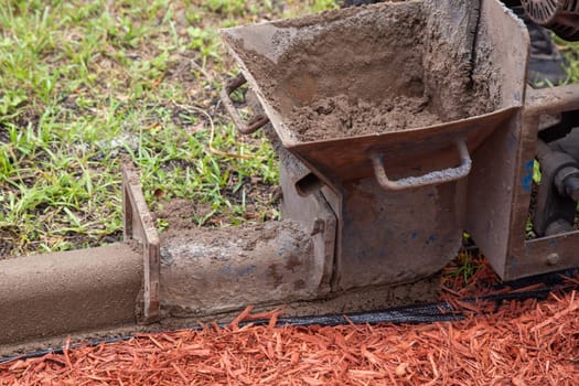 Pouring concrete for a garden border