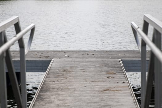 Metal floating fishing dock on a lake