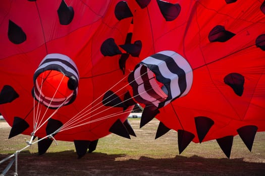 Two red kites being inflated for a festival