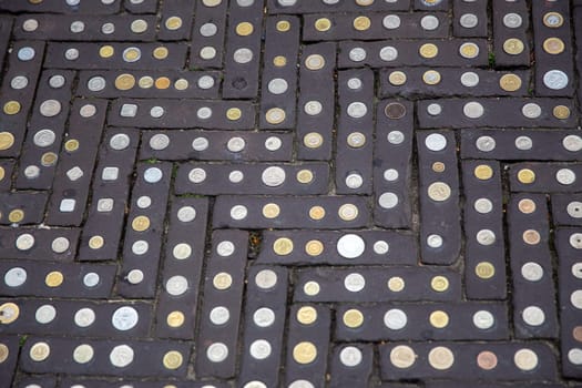 Coins on a walkway used as a decoration