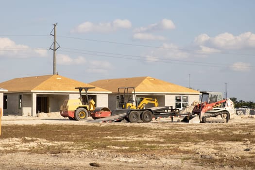 Several Houses being built on a construction site