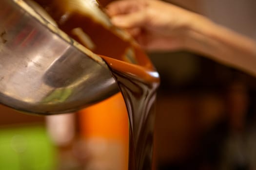 A Chocolatier Pouring Melted Chocolate