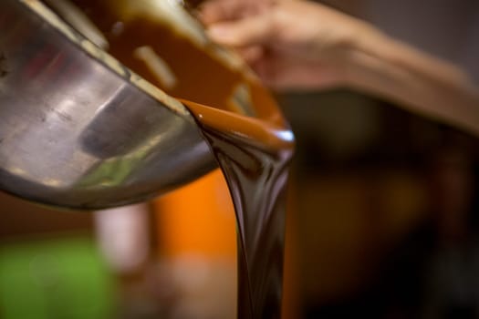 A Chocolatier Pouring Melted Chocolate