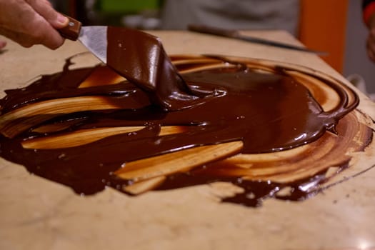 Chocolate being mixed and smoothing