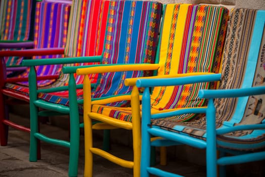 Handmade Colorful Peruvian Chairs in a Row