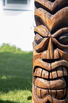 Wooden Tiki statue shot vertical