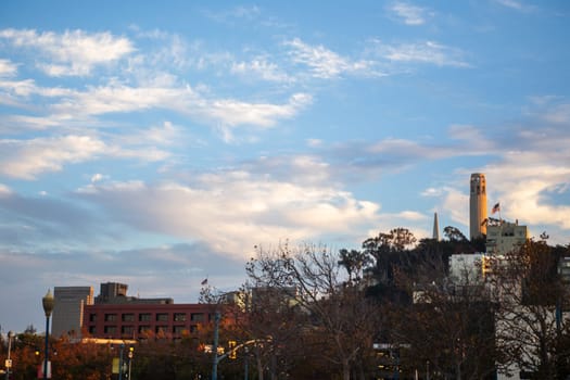 Coit Tower in San Francisco with a partly cloudy sky