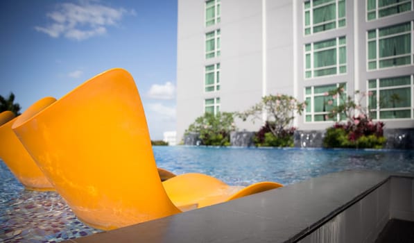 Resort Pool Resting for a couple vacationers