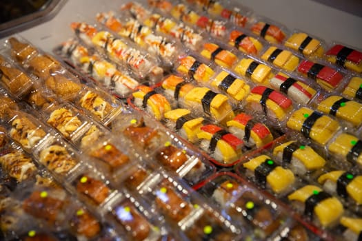 Bunch of Mini sushi on display to buy