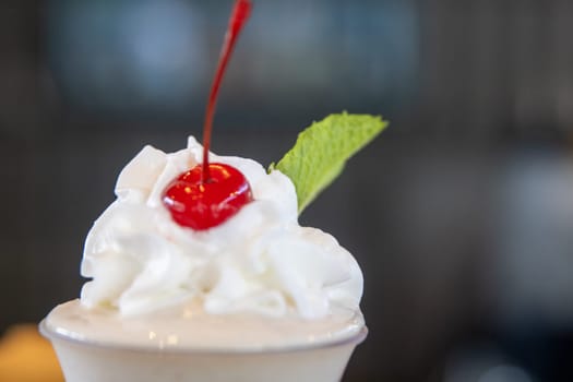 Whipped cream topping with a cherry