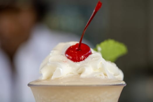 Whipped cream topping with a cherry