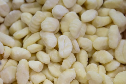 Fresh uncooked potato gnocci at a market
