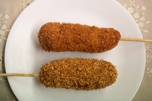 Hot Cheetos and Ramen Corn Dog on a plate