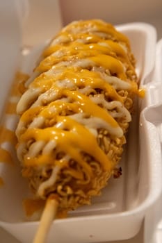 Japanese Ramen Corndog drizzled with sauce