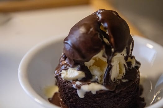 Small lava cake with ice cream an hardened shell