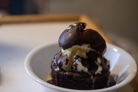 Small lava cake with ice cream an hardened shell